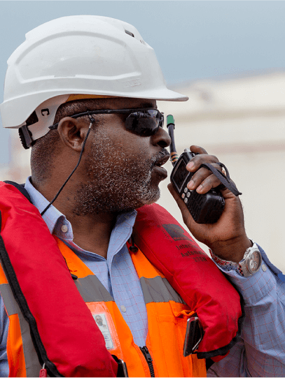 Man on radio with life jacket