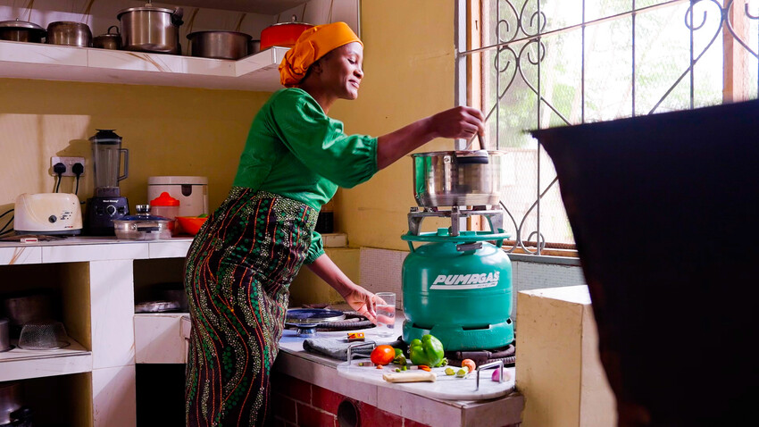 Woman Cooking with Puma LPG Canister 